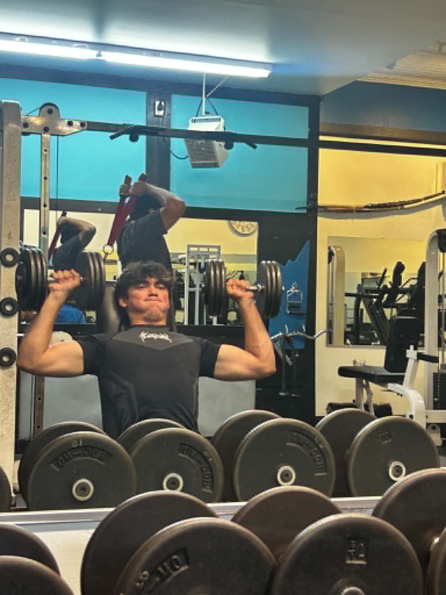 Daniel training with dumbbells